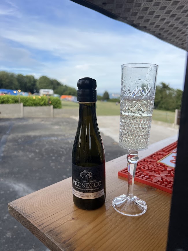 Enjoying a prosecco at Sam's Bar admiring the view at Kingsdown Camping
