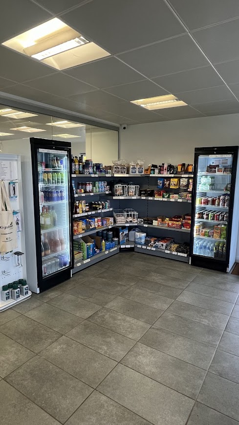 Kingsdown Camping Shop shelves with products.
